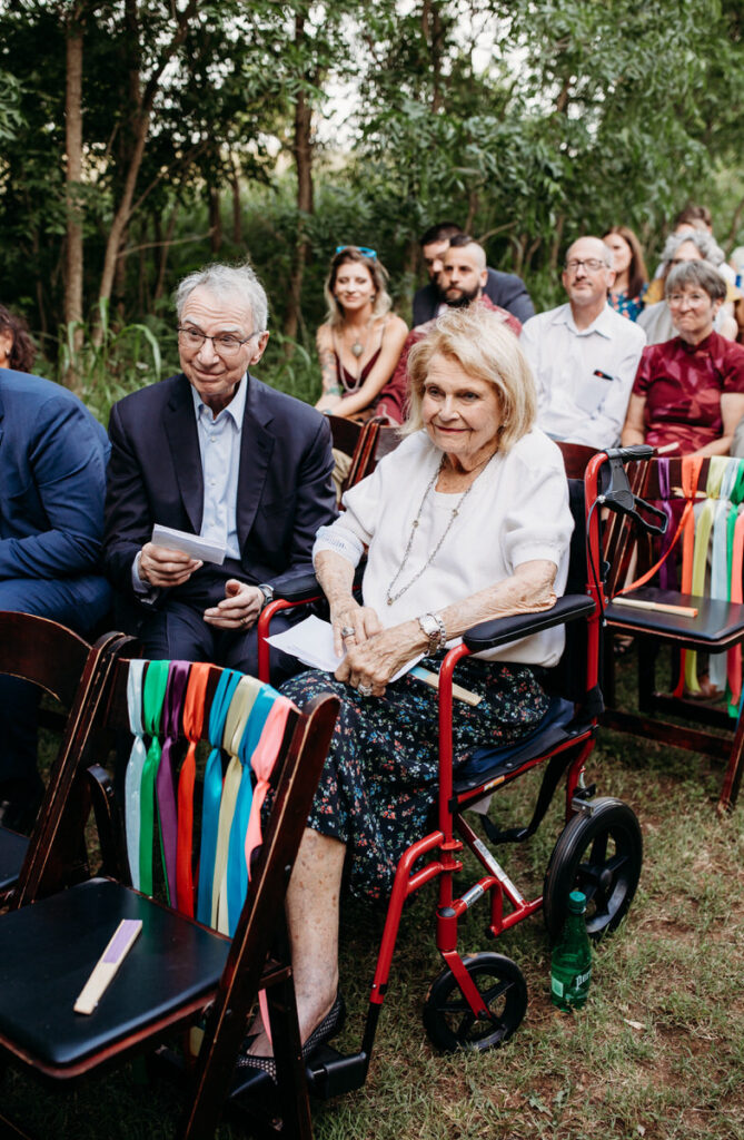 Elderly guests watch wedding ceremony